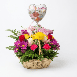 Colorful flower basket with pink, yellow, and red blooms and a "Love You Mom" heart balloon.